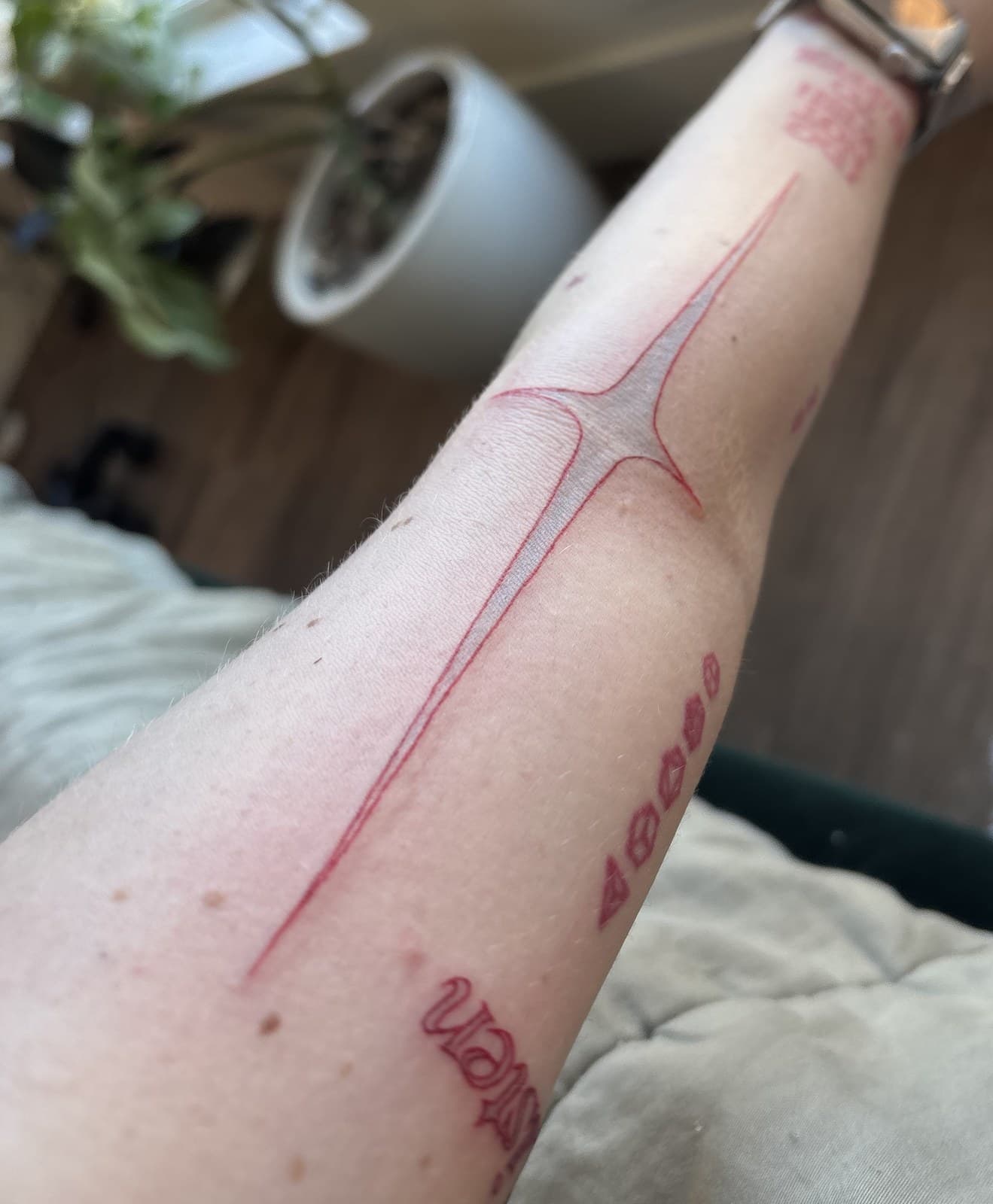 dagger forearm tattoo by Taetyn Panagos