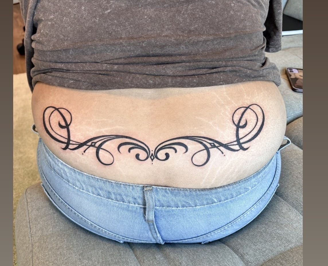 filigree back tattoo by Taetyn Panagos