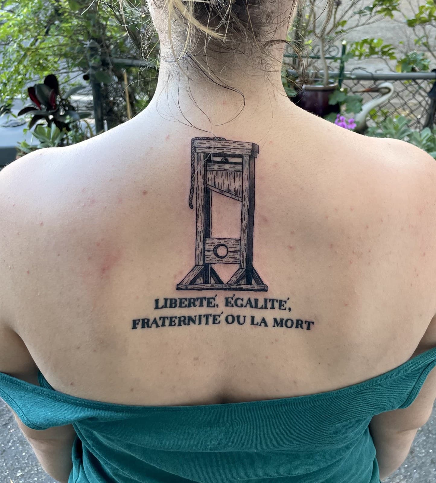 guillotine tattoo by Taetyn Panagos