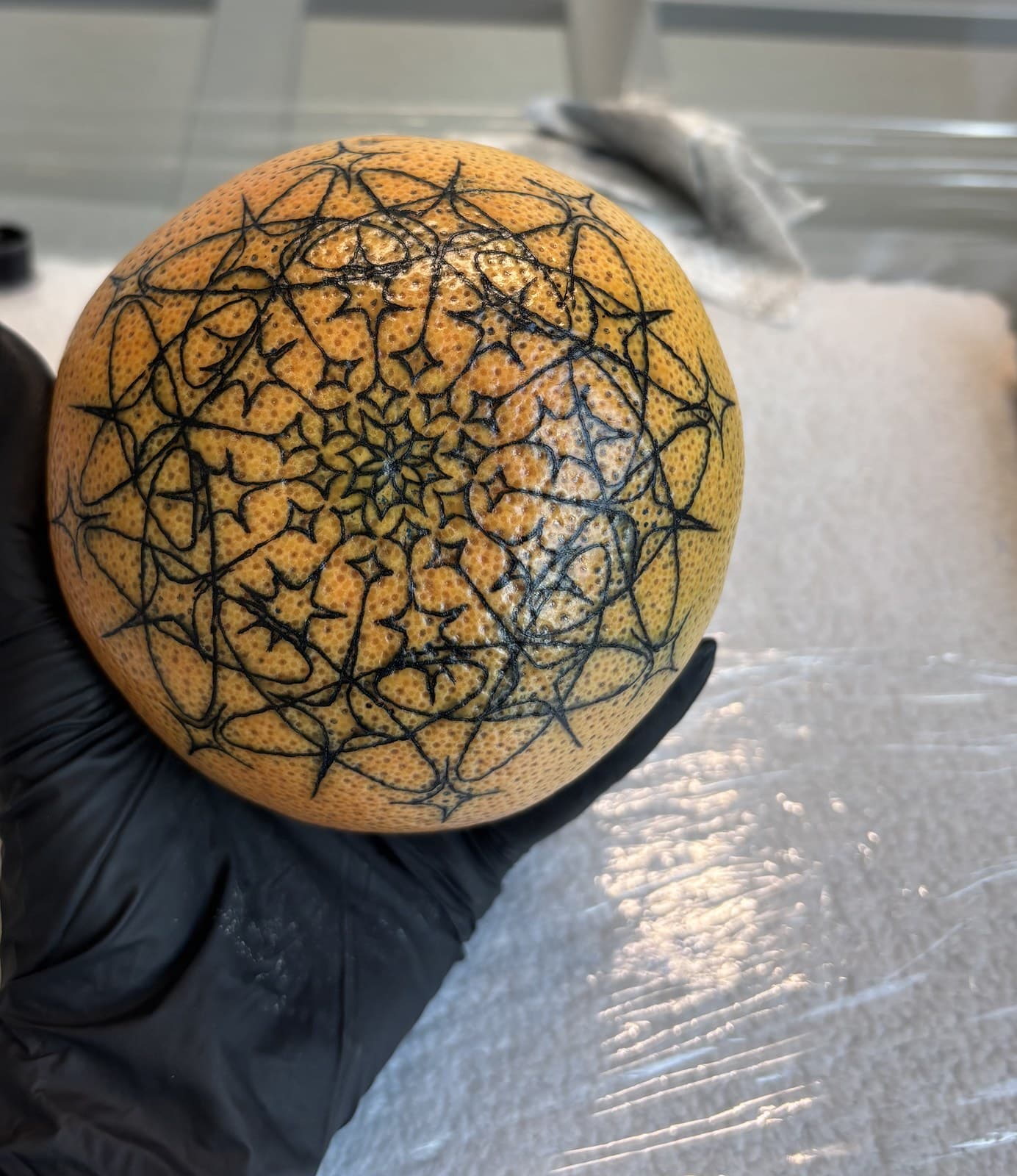 orange mandala tattoo by Taetyn Panagos