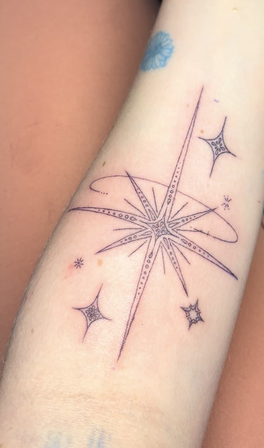 star sparkle forearm tattoo by Taetyn Panagos
